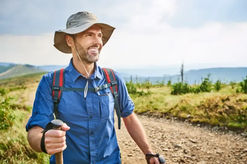 imgi_14_portrait-of-smiling-man-hiking-in-the-mountains-2024-09-22-08-31-49-utc